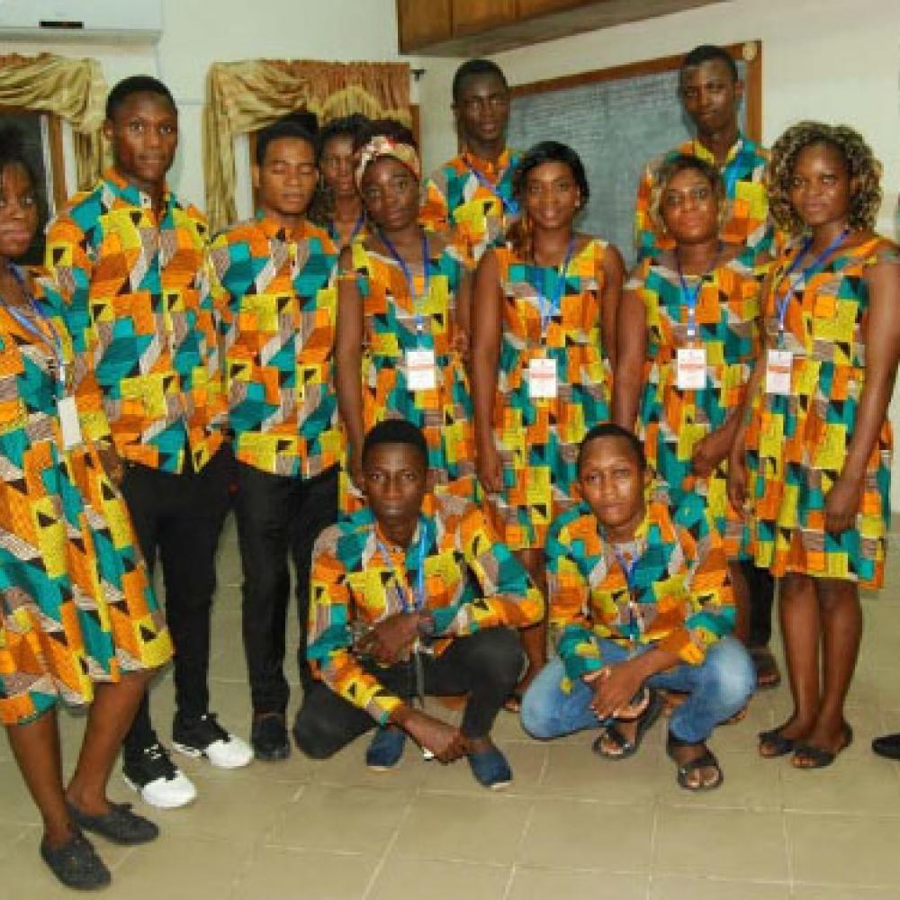Fotografía que muestra una celebración celebrada en Benin para conmemorar el Día Mundial del PT 2018