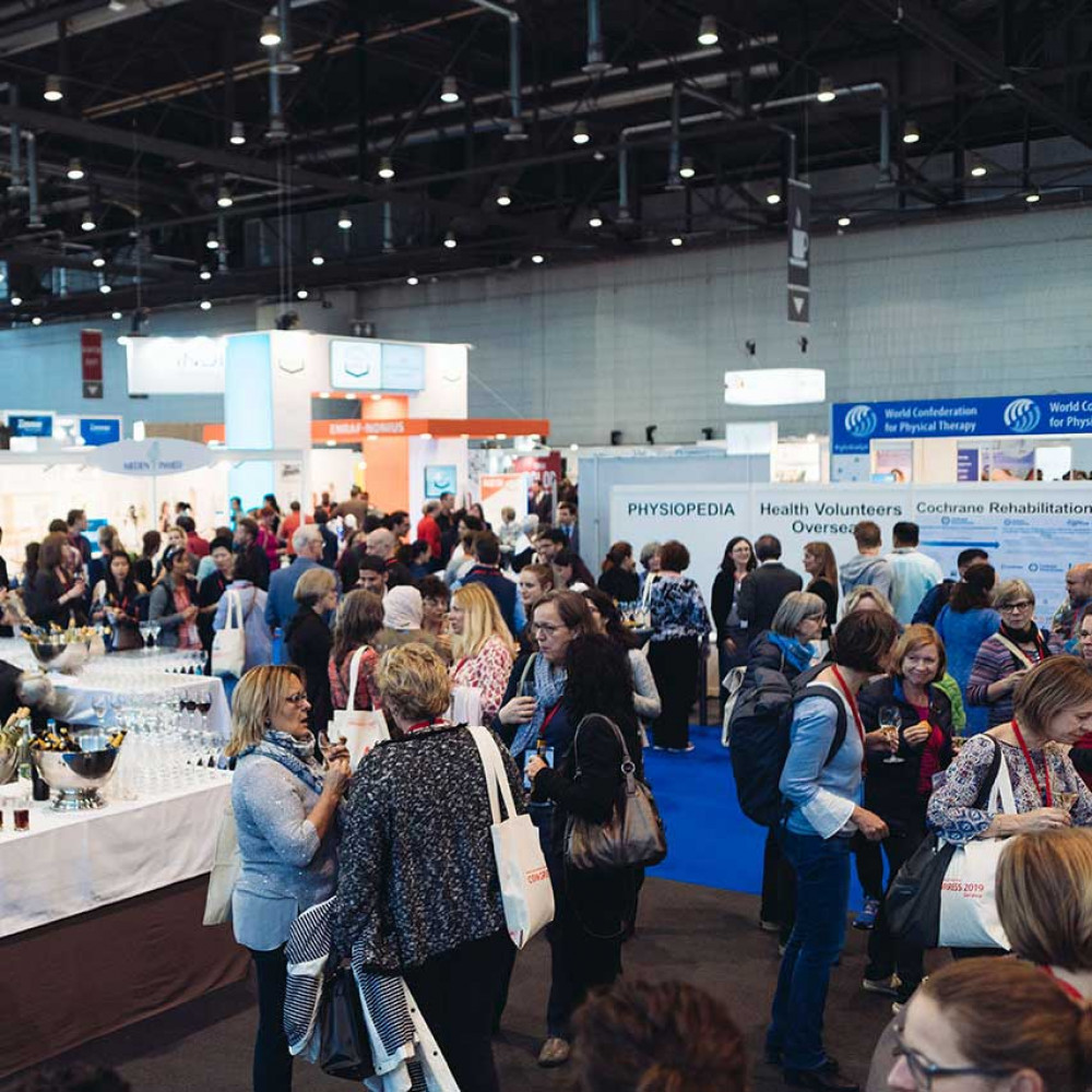 Crowds of people in the exhibition hall at WCPT2019