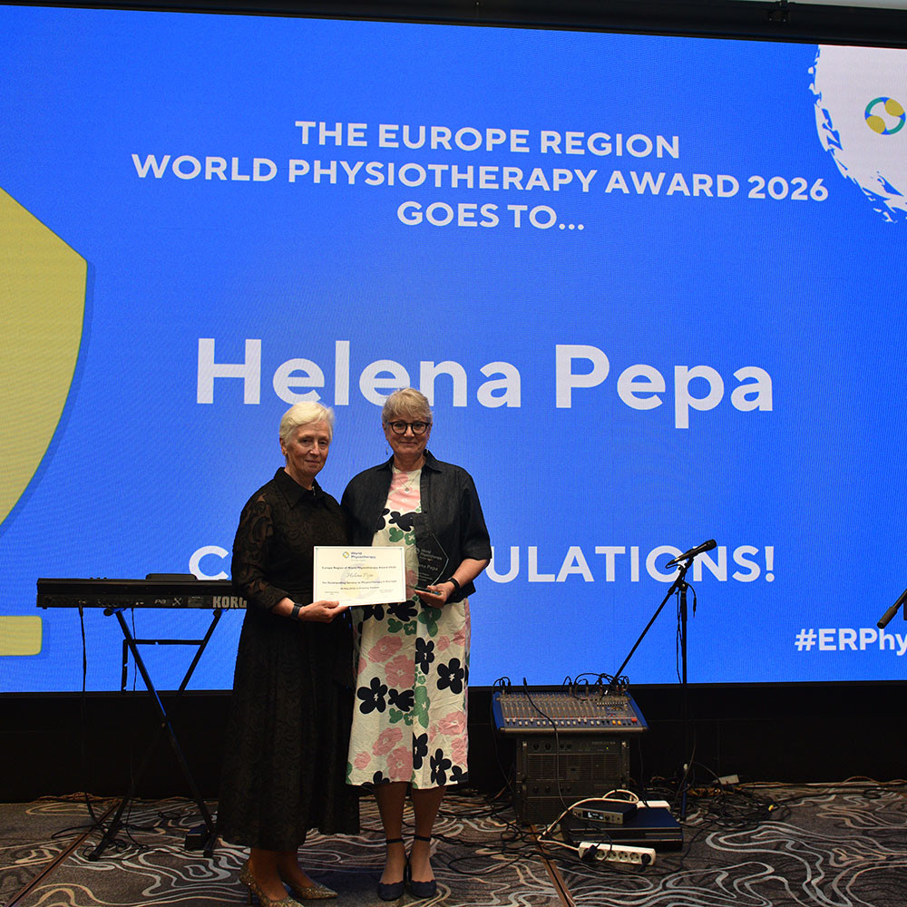 Photo of Helena Pepa receiving award from Esther-Mary D'Arcy