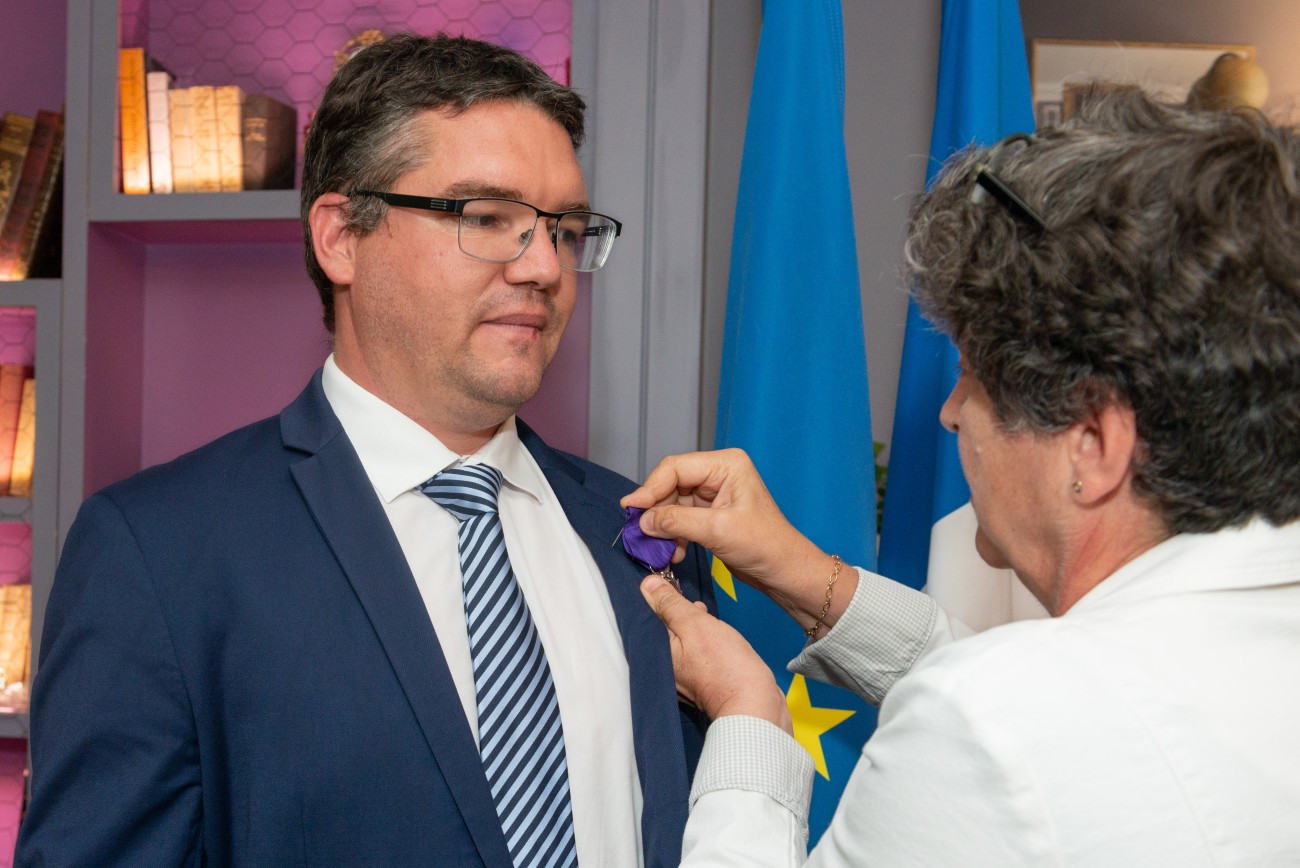 Nicolas Pinsault receiving a Knight of the Order of Academic Palms