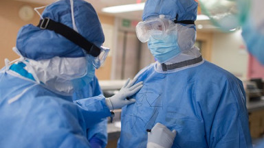 Two physiotherapists wearing PPE