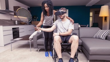 Man in wheelchair uses VE to play tennis